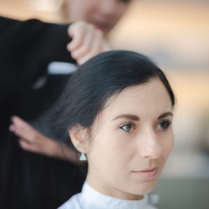 concept of professional fashion hairdresser and hair beauty salon, hairstylist making treatment to woman client person, by using scissors for haircut and coiffure care, girl style in studio lifestyle